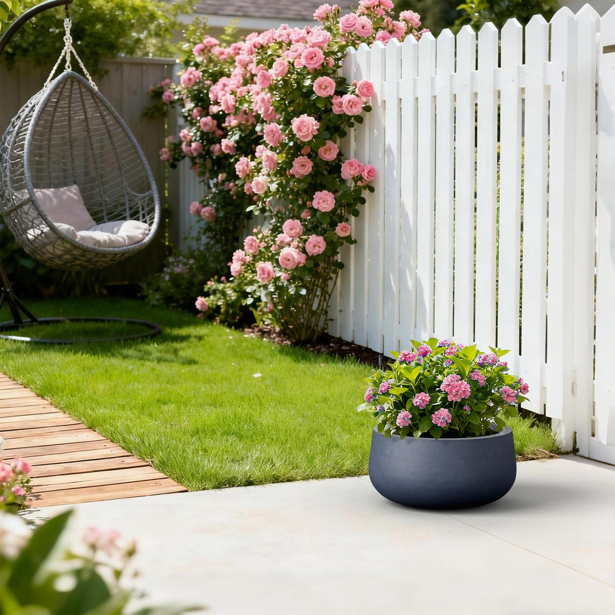 Kante 15.7-inch round planter on patio demonstrating ample growing space