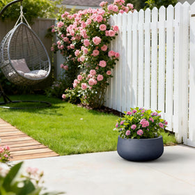 Kante 15.7-inch round planter on patio demonstrating ample growing space