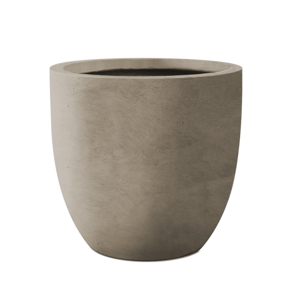 Kante 16.5-inch round concrete planter, front view showing authentic pores and modern texture.