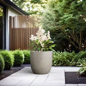 Kante 16.5-inch round concrete planter rubber plug for indoor or outdoor setups.