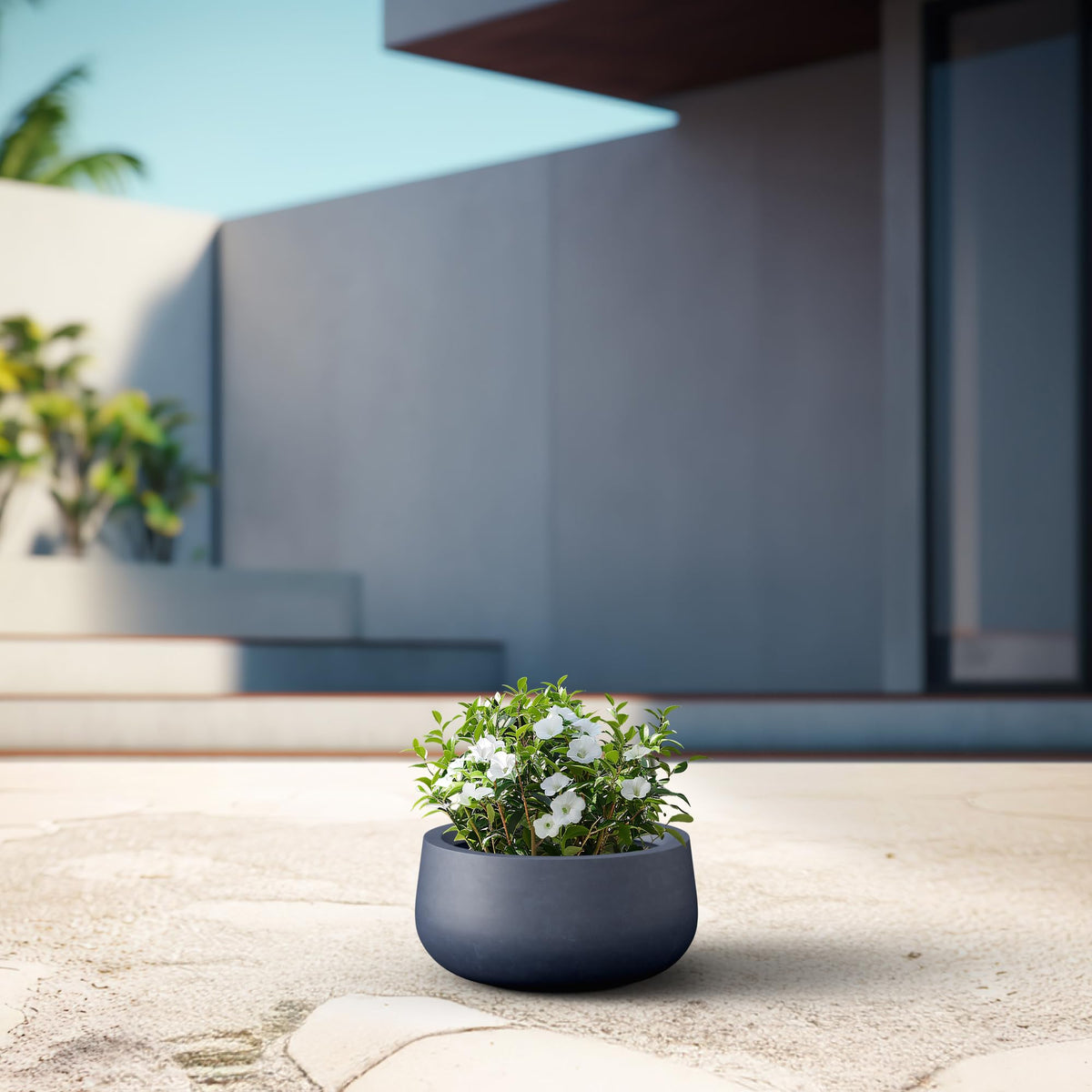 Kante balcony planters on a patio creating varied greenery accents