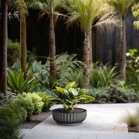 Kante concrete planter with drainage hole and rubber plug for flexibility.