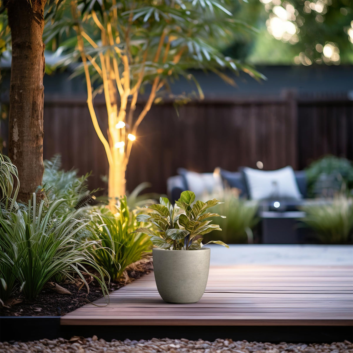 Kante large indoor-outdoor planter with drainage hole and rubber plug for versatile watering.