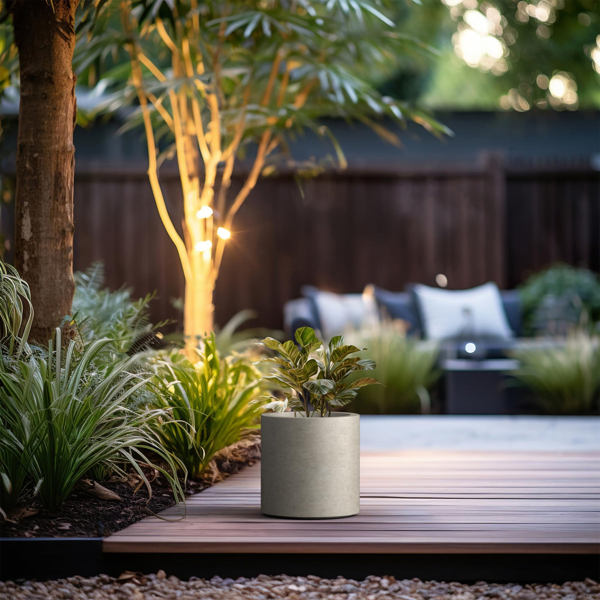 Kante large round planter on steps boosts contemporary curb appeal.