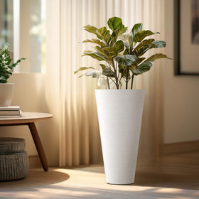 Kante planter textured white surface adds contemporary touch to spaces.