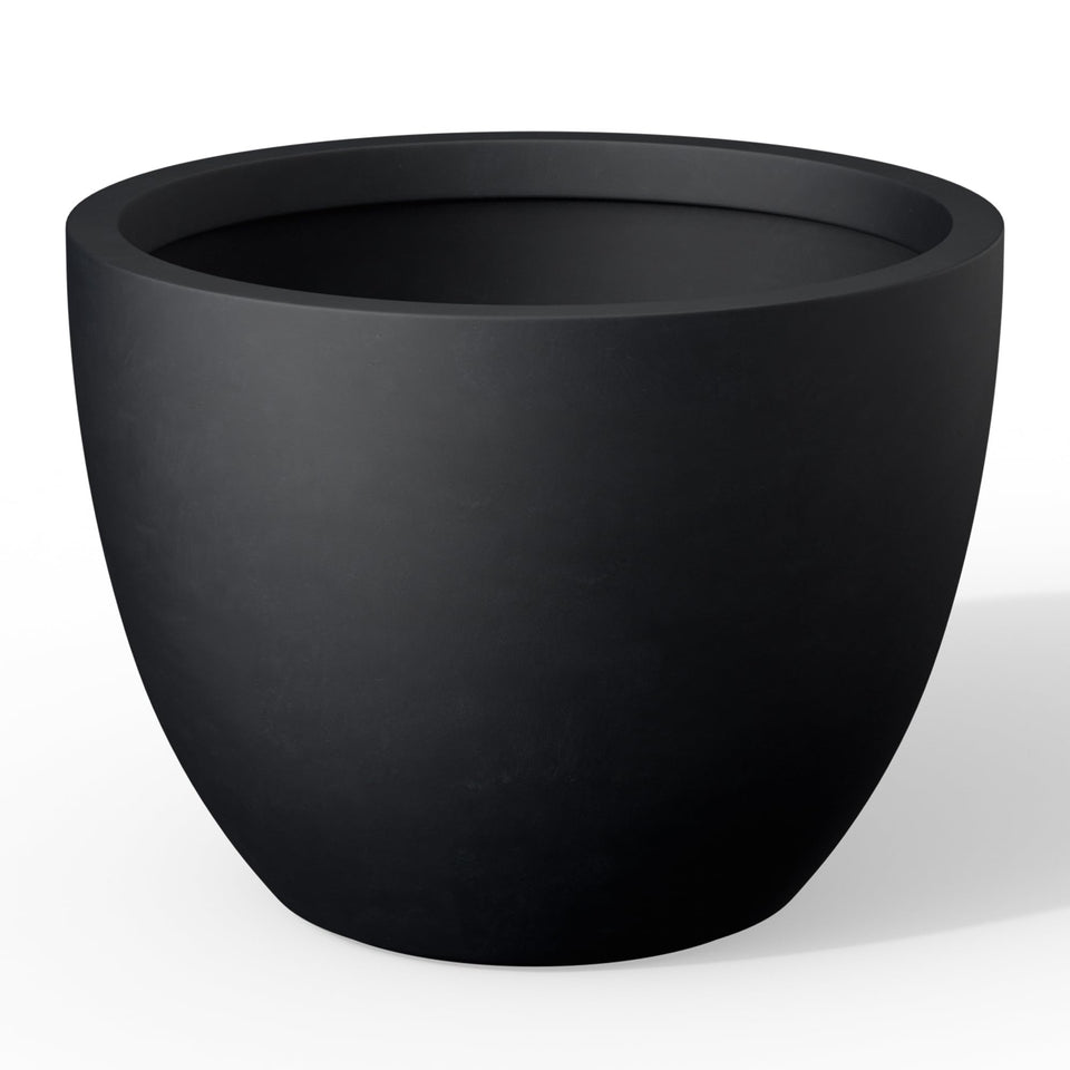 Kante round concrete planter front view with modern porous finish for indoor or outdoor decor.