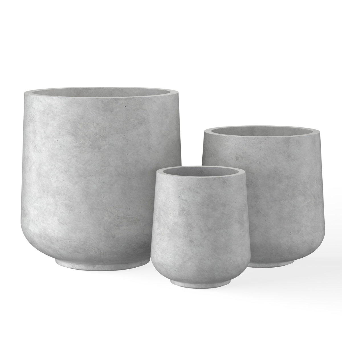 Kante round concrete planter, front view, adds outdoor elegance with modern curves.