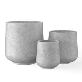Kante round concrete planter, front view, adds outdoor elegance with modern curves.