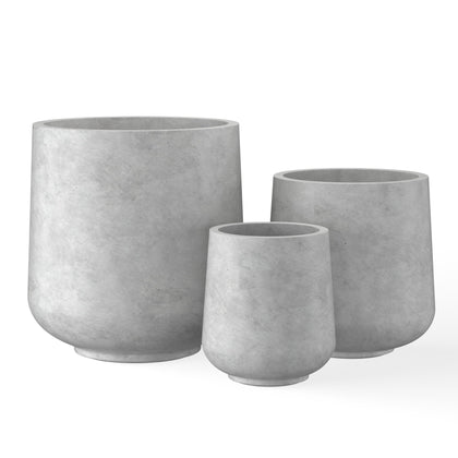 Kante round concrete planter, front view, adds outdoor elegance with modern curves.