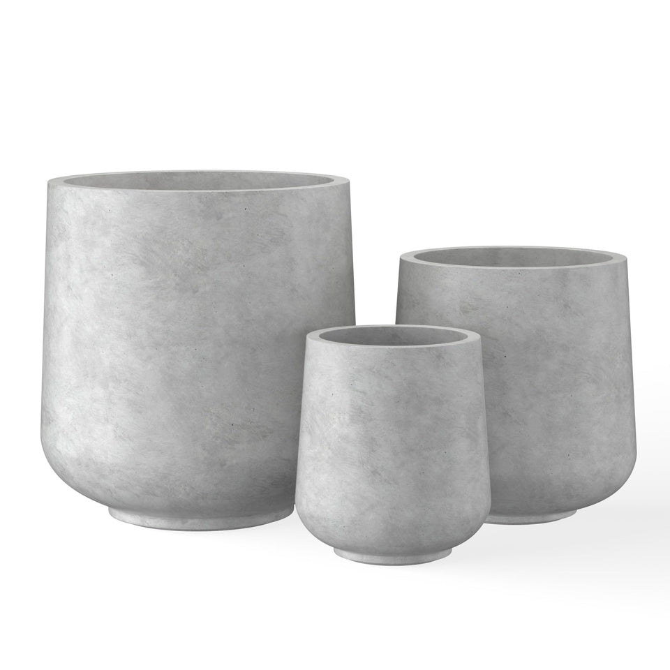 Kante round concrete planter, front view, adds outdoor elegance with modern curves.