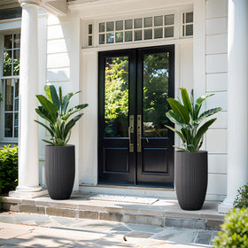 Kante round planter in lightweight concrete offering durable, weather-resistant display.