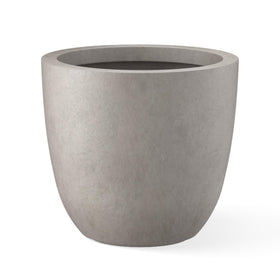 Kante round concrete planter on outdoor display adds modern curb appeal.