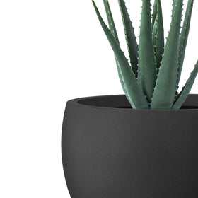 Kante round concrete planter set 3 on patio with lush greenery