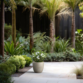 Kante round contemporary planter highlights visible pores and industrial charm.
