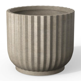 Kante Round Fluted Planter with drainage hole, ideal for indoor plant displays.