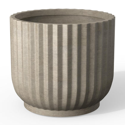 Kante Round Fluted Planter with drainage hole, ideal for indoor plant displays.