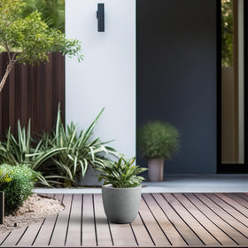 Kante round planter highlighting its generous growing space.
