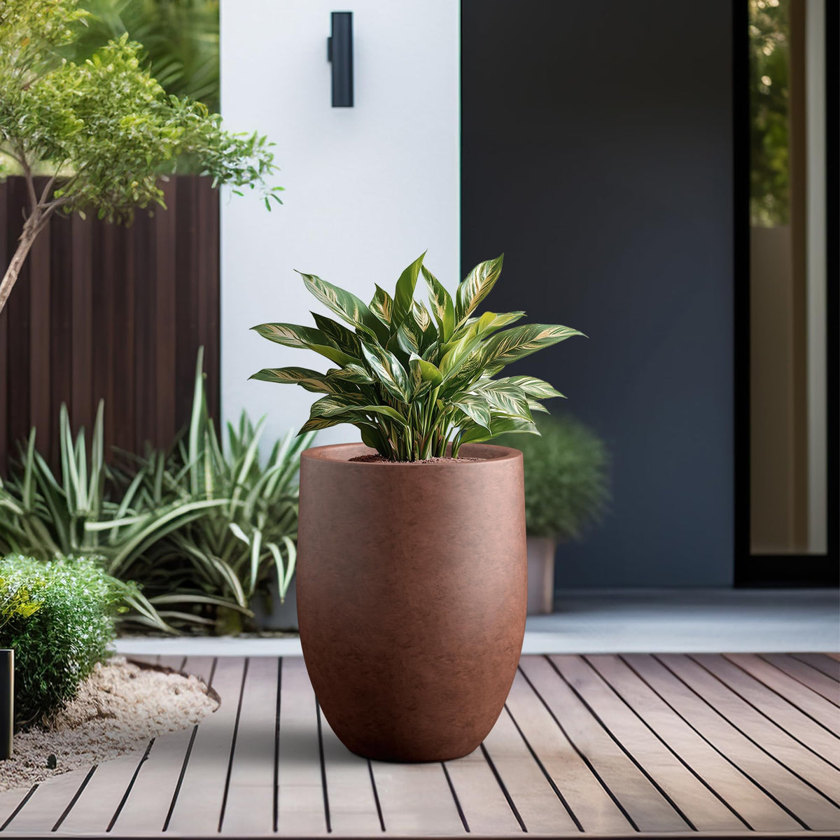 Kante smooth concrete finish planter complements modern interiors.