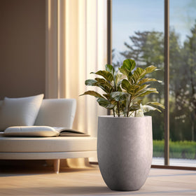 Kante tall planter outdoors on patio showcasing weather-resistant durable design.
