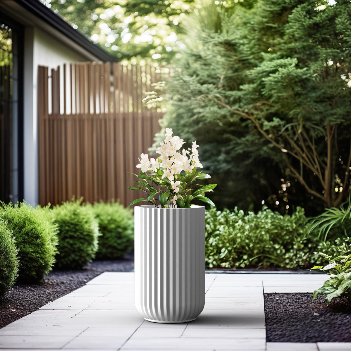 Kante tall fluted planter showing drainage hole for healthy watering