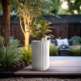 Kante tall fluted planter with rubber plug for versatile placement