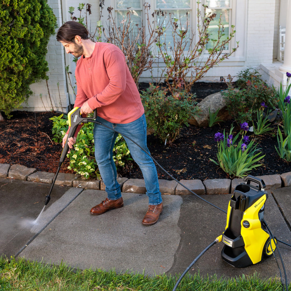 Karcher K5 Vario Power wand demonstrates adjustable cleaning modes for versatility.