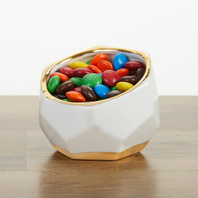 Kate Aspen planters paired with candles and beads for chic table decor.