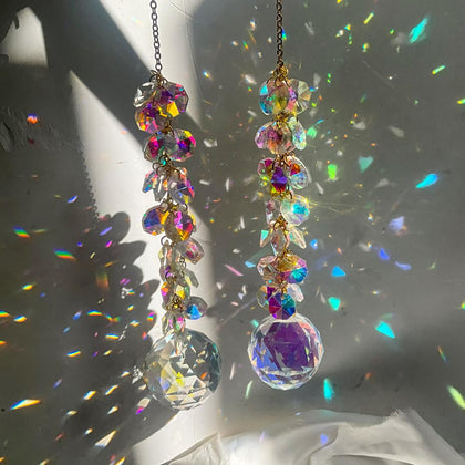 KEINIA Aurora 40mm prism suncatchers in a window creating vivid rainbow reflections