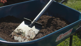 Kenyon S550 wide head enables stable trench width for irrigation tubing.