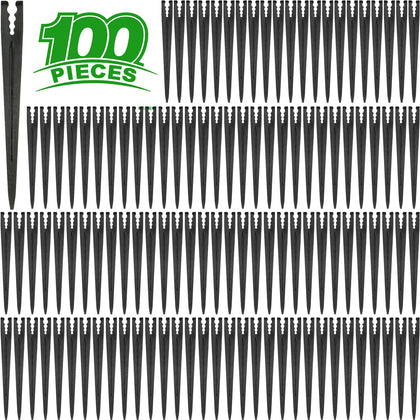 Kepmix 100-stake bundle securing drip lines for efficient garden irrigation.