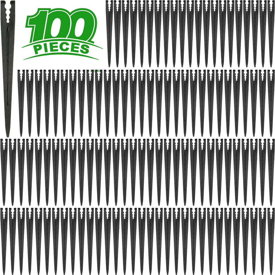 Kepmix 100-stake bundle securing drip lines for efficient garden irrigation.