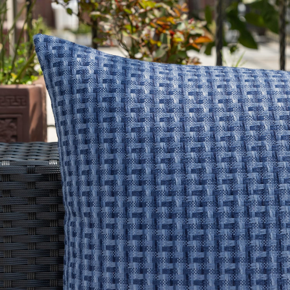 Kevin Textile outdoor decor on patio couch with navy pillow cover