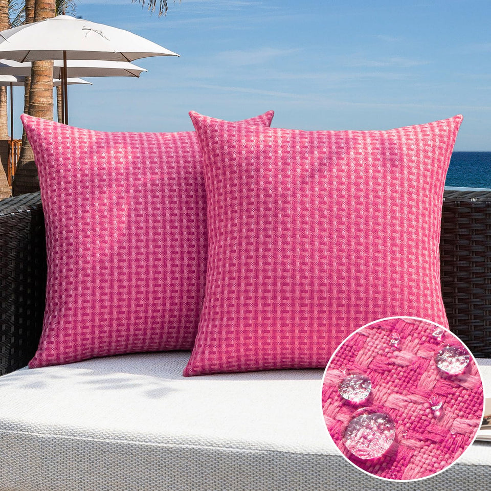 Kevin Textile outdoor pillow cover in hot pink; water-resistant for garden and patio.