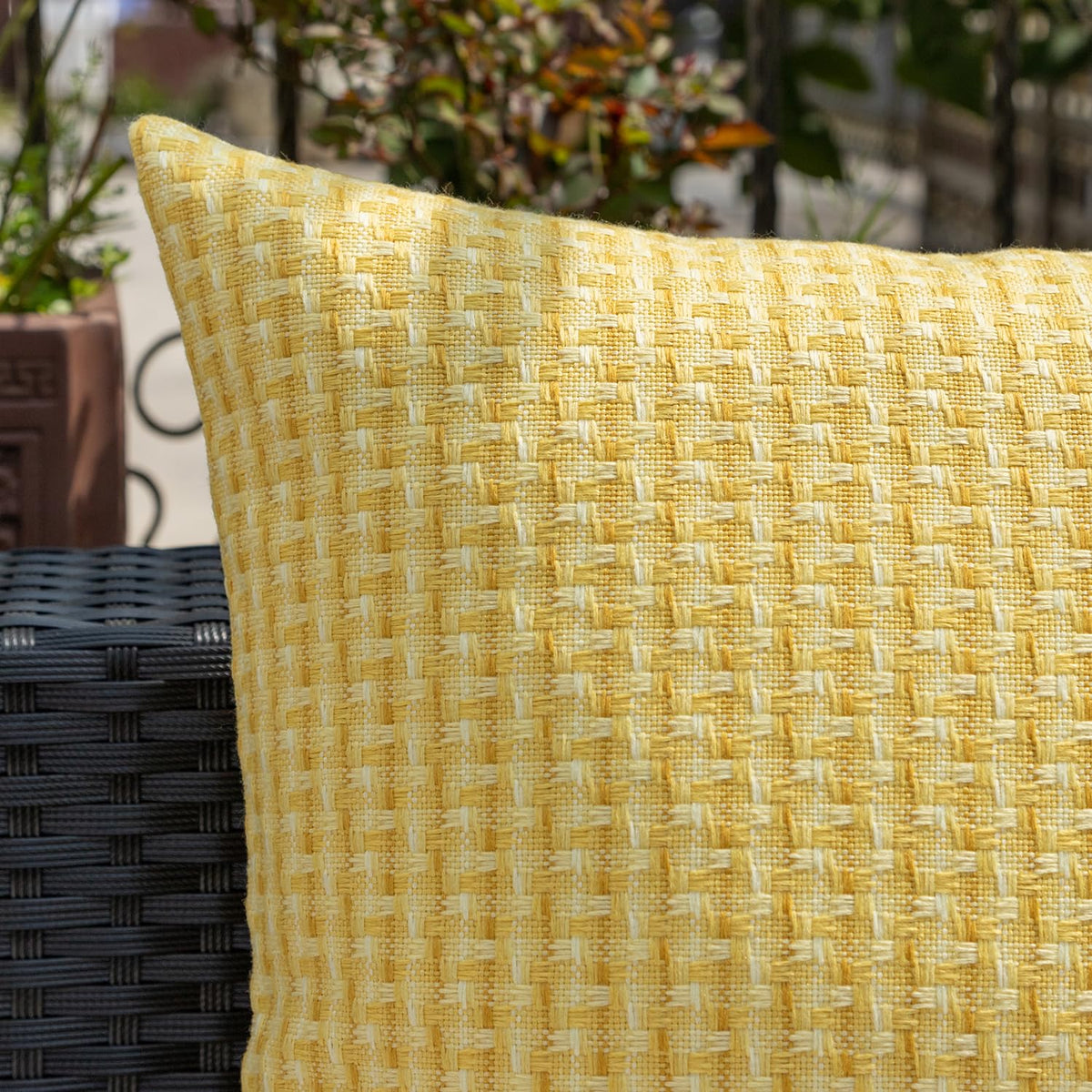 Kevin Textile patio-use pillow cover yellow on outdoor seating