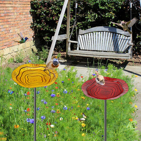 KHayRovies sturdy metal-pole birdbath stands securely in soil for year-round use