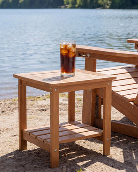Kibaso Adirondack side table placed indoors beside a sofa for versatility