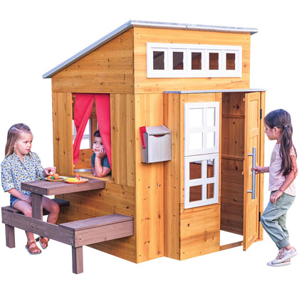 KidKraft Modern Playhouse outdoors shows sturdy wooden structure for durable backyard play.