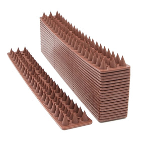 Kimann bird spikes defender installed on a brown fence deters birds and protects outdoor spaces.