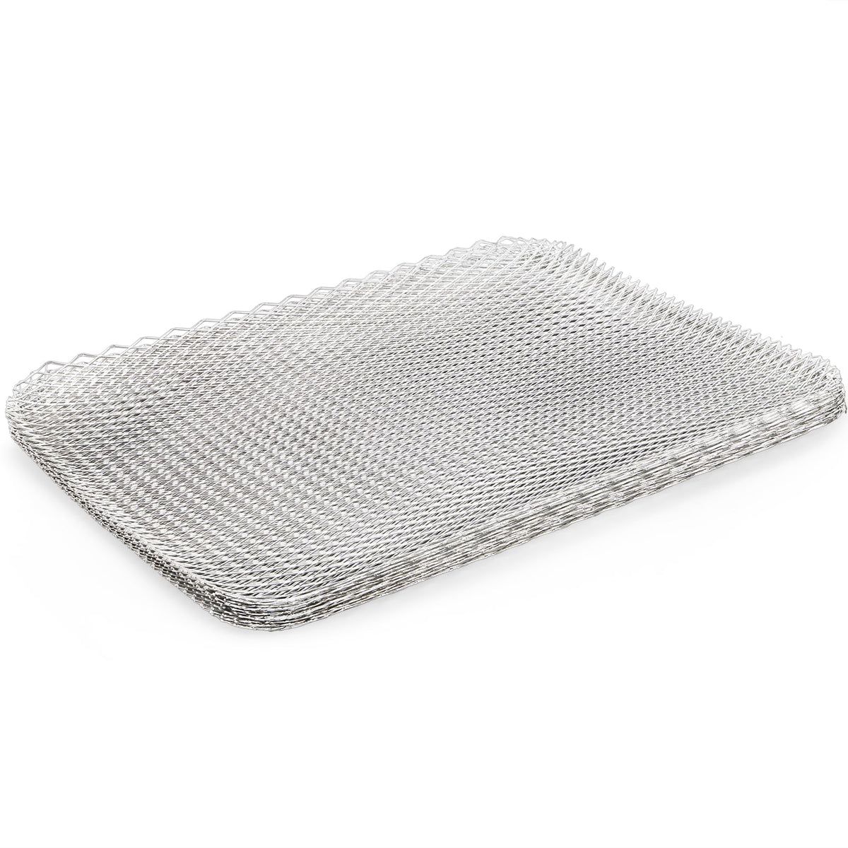 Kingrol rectangular grill toppers laid on a grate to prevent slipping