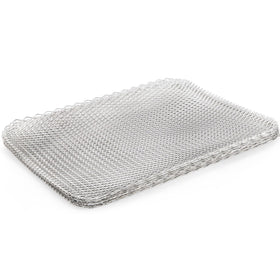 Kingrol rectangular grill toppers laid on a grate to prevent slipping