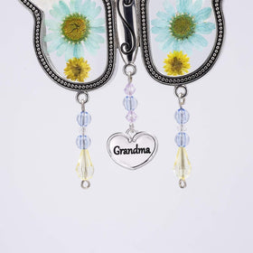 Kingtto blue and white butterfly suncatcher on a sunny windowsill