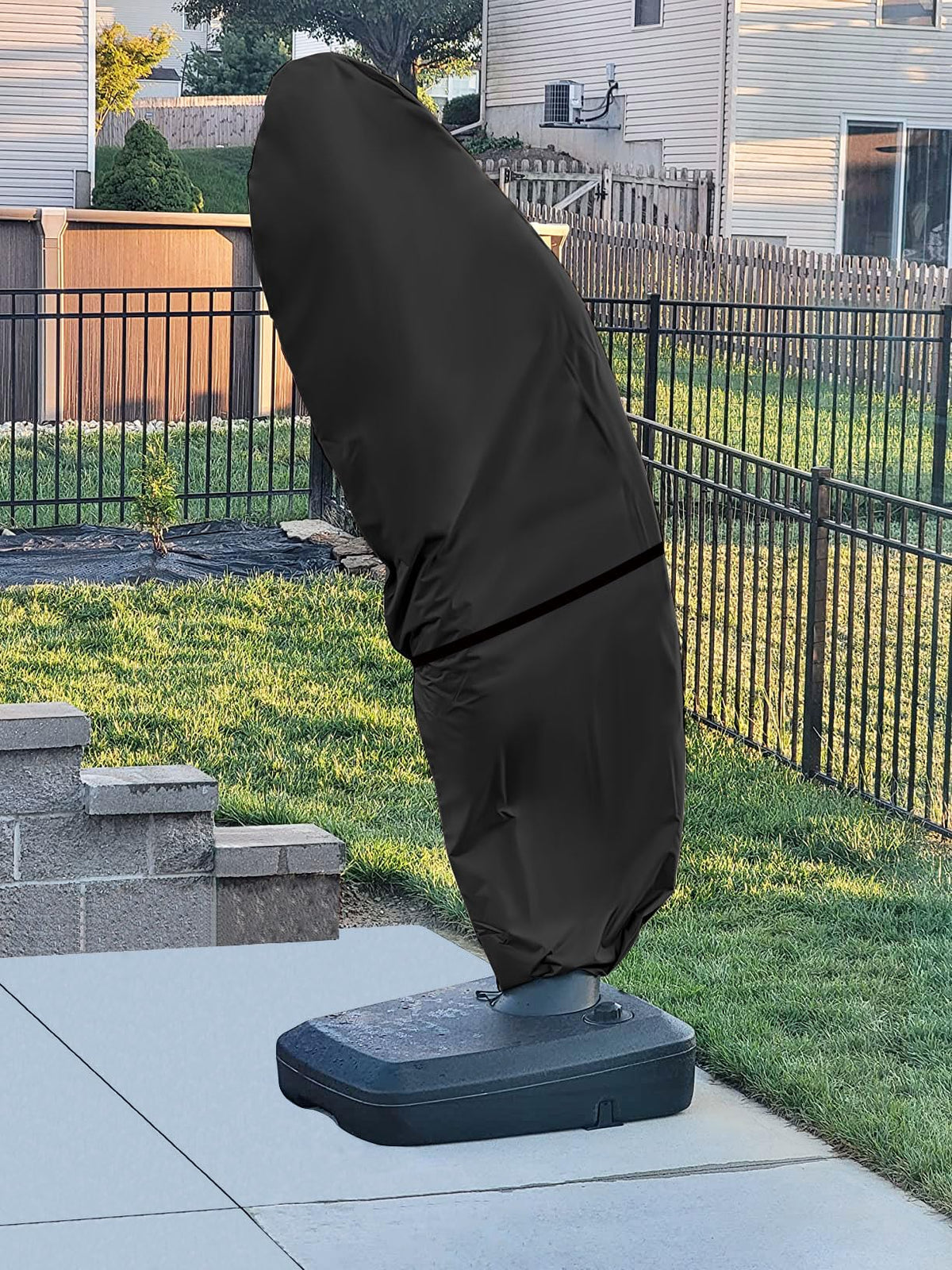 Kipiea umbrella cover in outdoor setting against light drizzle