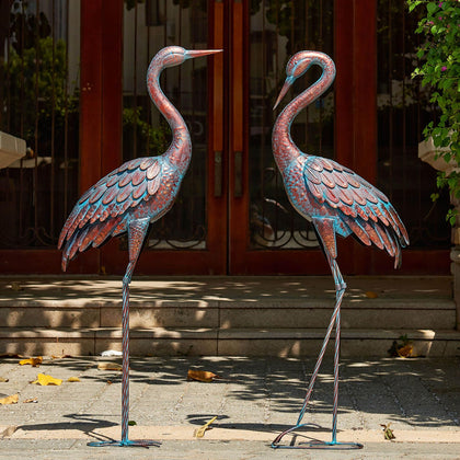 Kircust garden crane statues with patina finish add elegant outdoor decor.