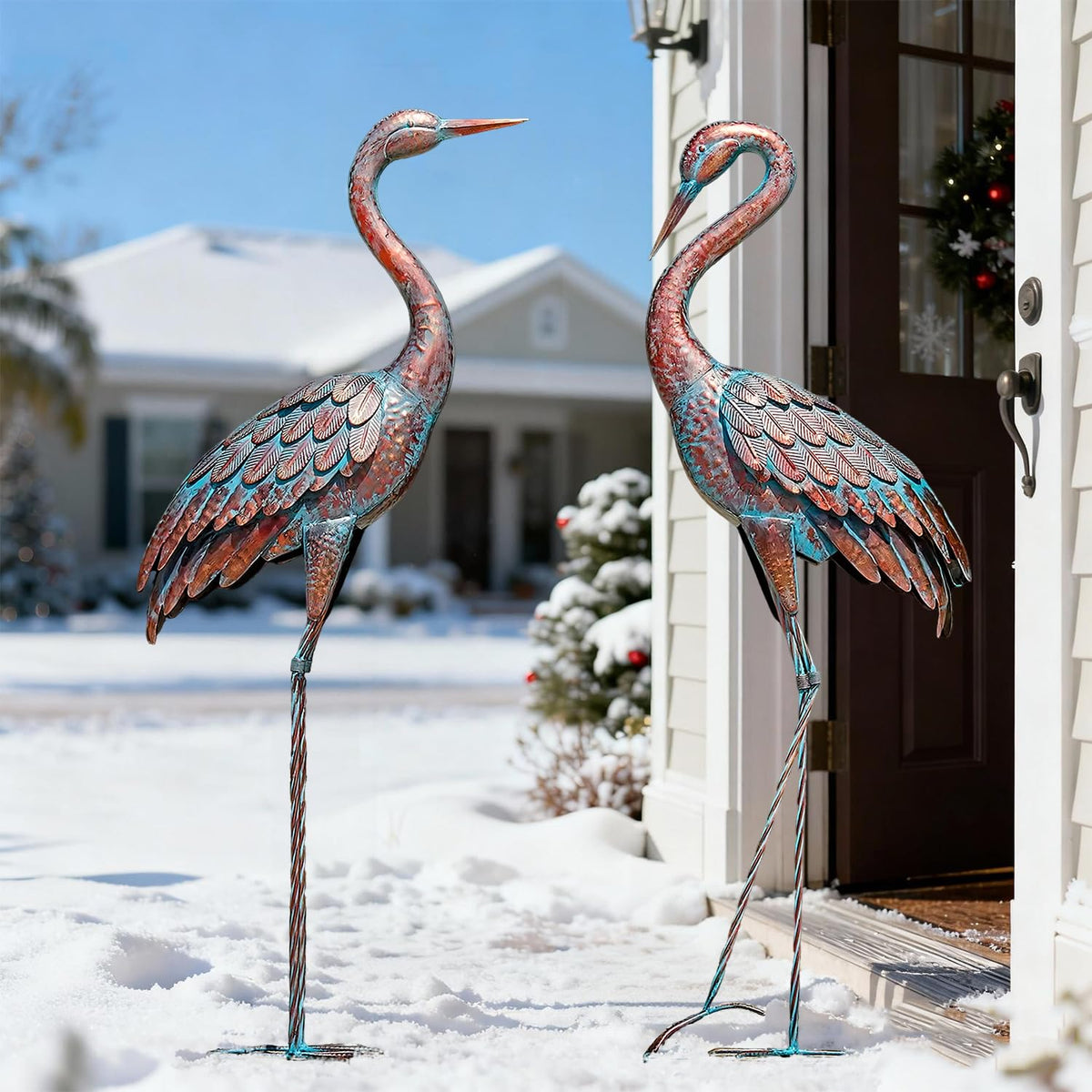 Kircust patina finish crane figure enhances garden focal point.