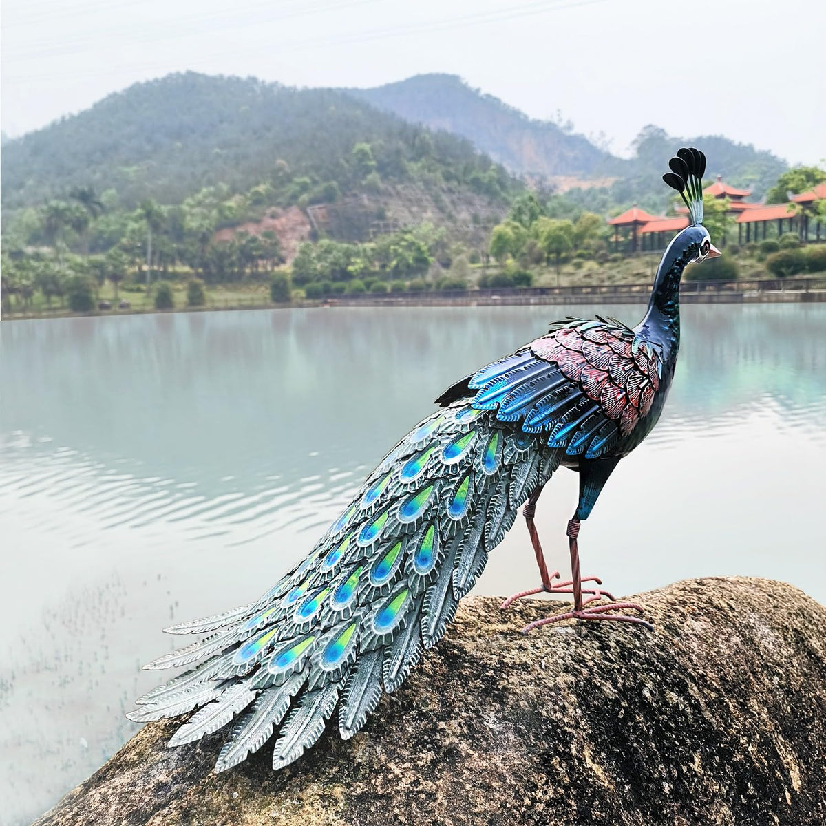 Kircust metal peacock sculpture ideal for yard display.