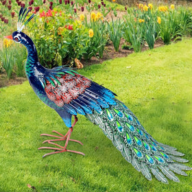 Kircust hand-finished peacock statue greets guests at entrances.