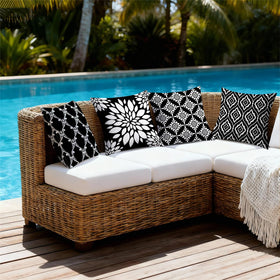 KISVODS garden porch setup featuring four black outdoor cushion covers on furniture.