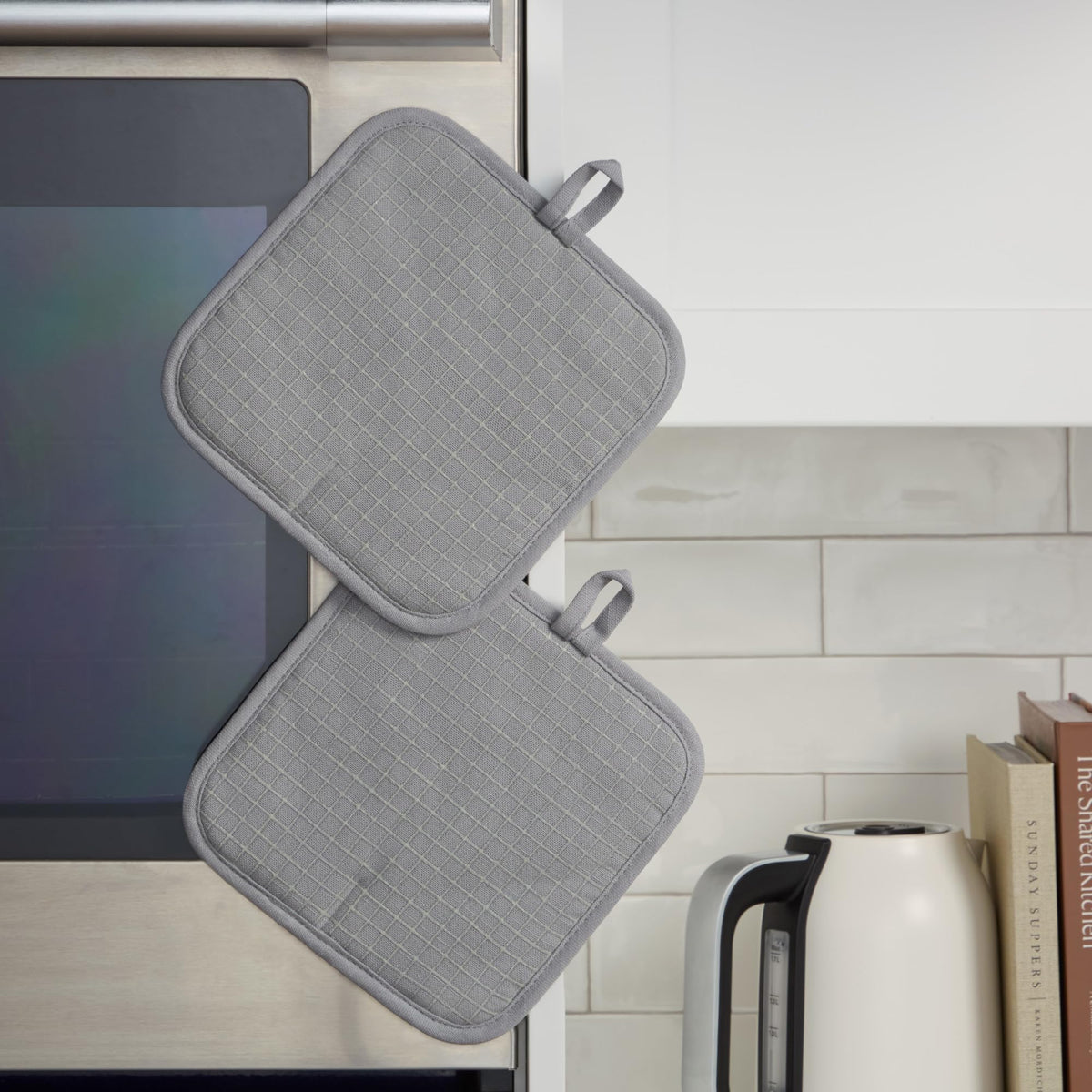 Magnetic cuff and hanging loop on KitchenAid Gridlines Pot Holder for easy storage.
