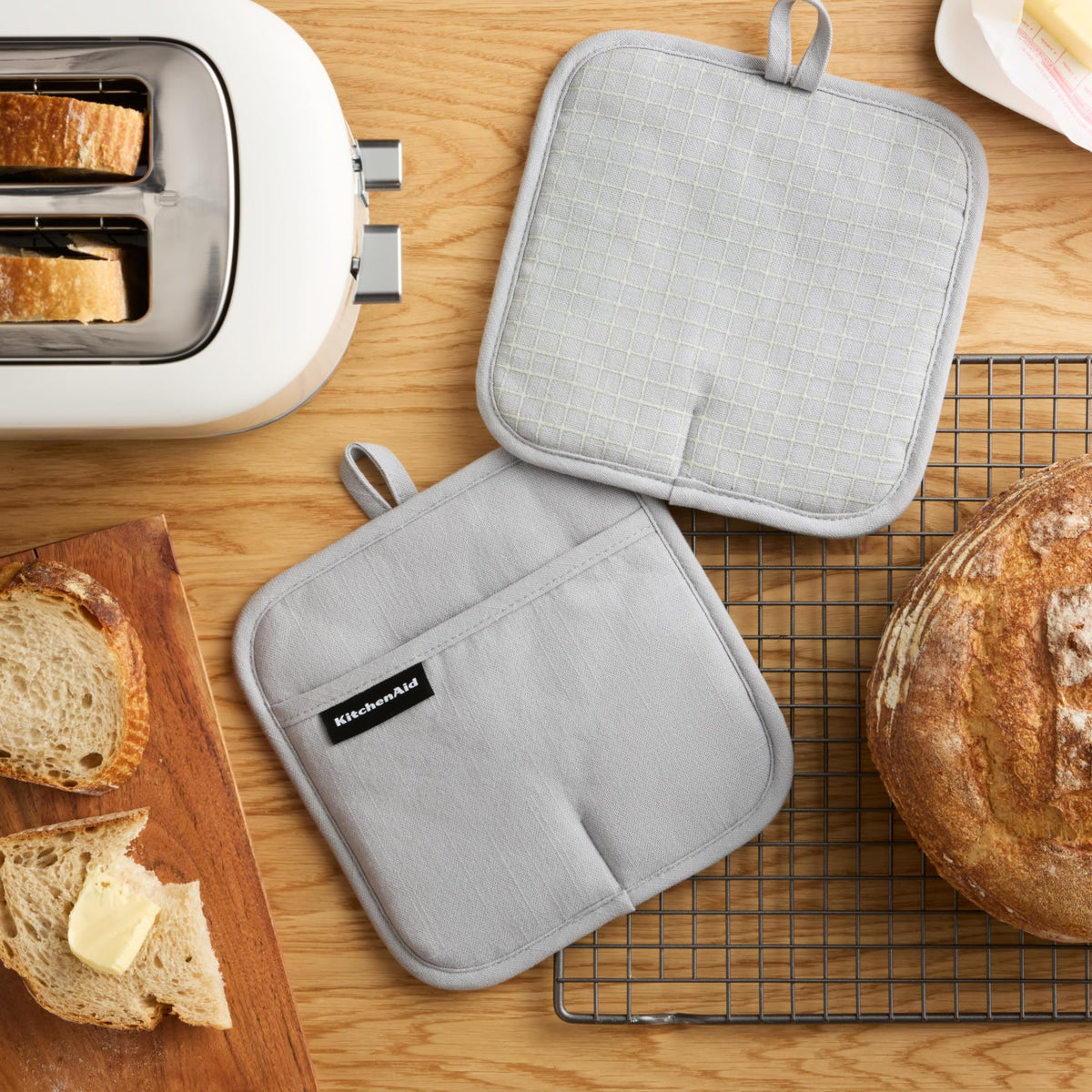 KitchenAid Gridlines Pot Holder showing slip-resistant silicone grip for secure lifting.