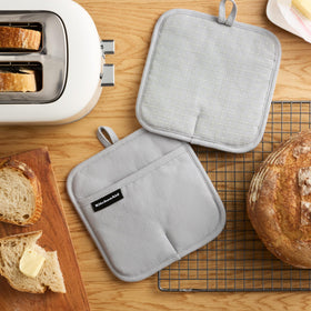 KitchenAid Gridlines Pot Holder showing slip-resistant silicone grip for secure lifting.